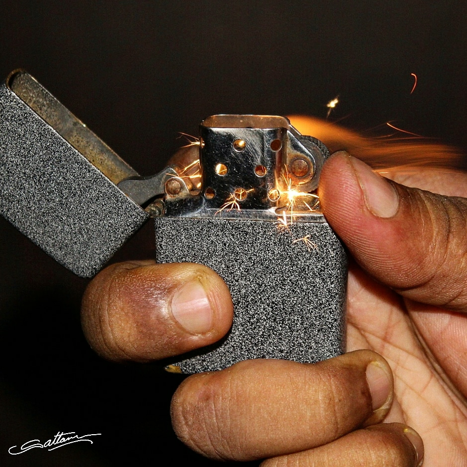 Dark background zippo lighter. Sattam photography. 